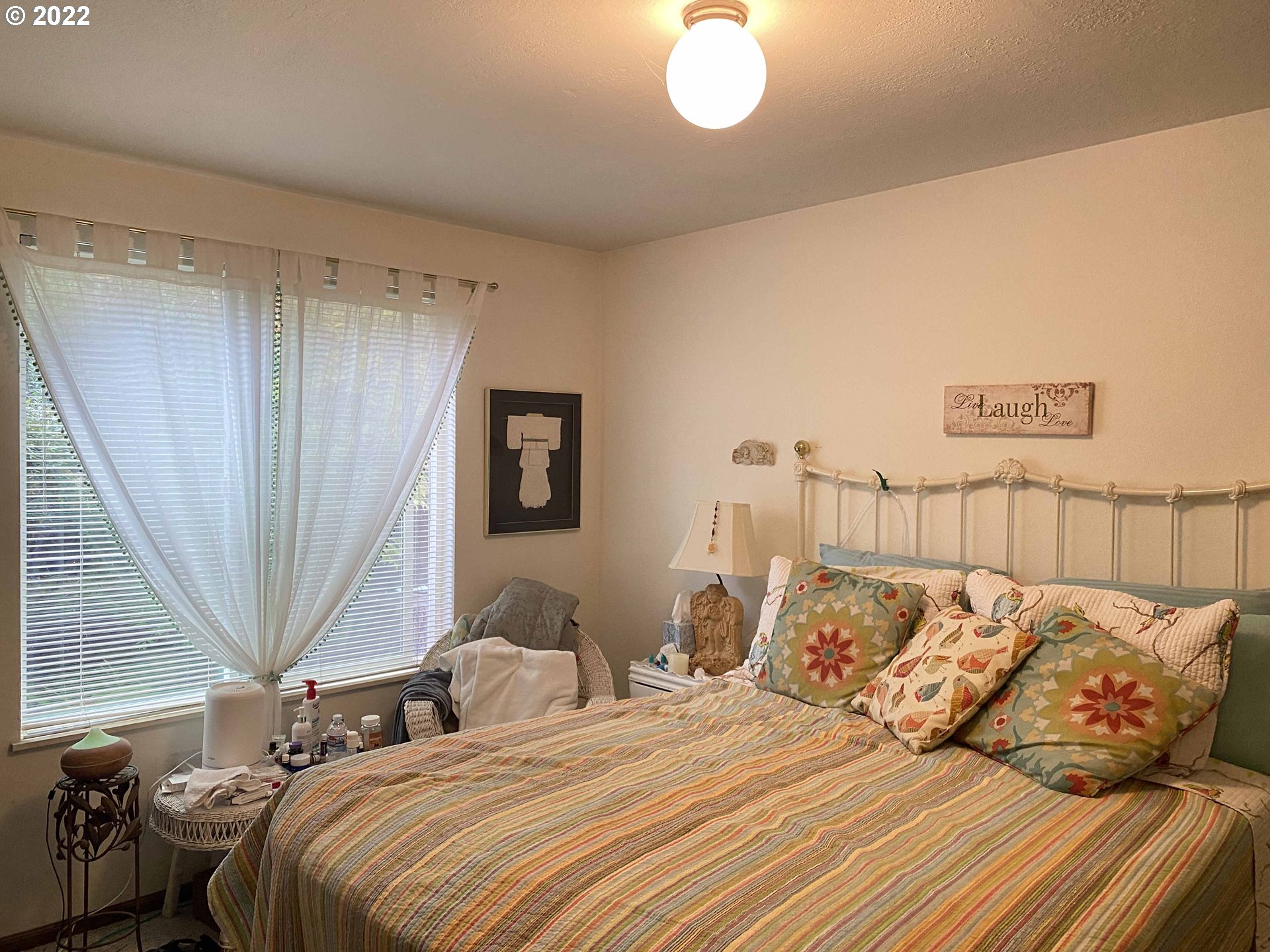 2222 11th Street Florence, OR 97439 - Photo 11 of 32 a bedroom with bed and a balcony