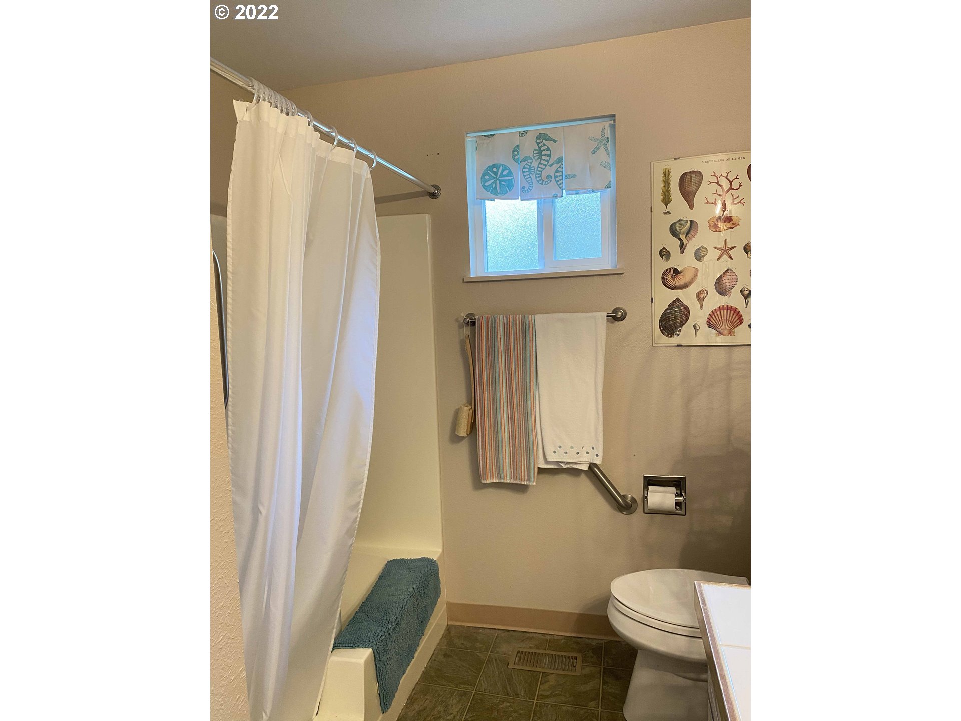 2222 11th Street Florence, OR 97439 - Photo 14 of 32 a bathroom with a toilet and a shower