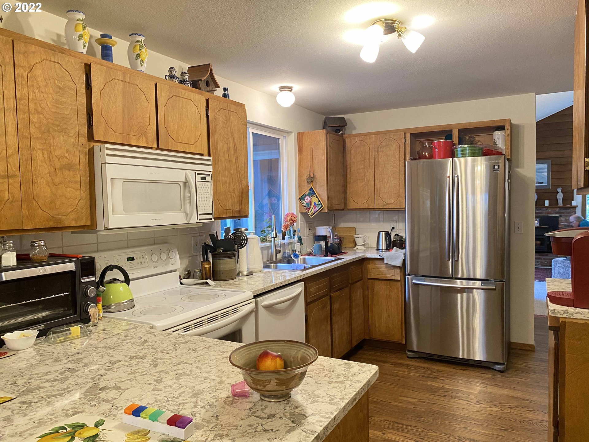 2222 11th Street Florence, OR 97439 - Photo 20 of 32 a kitchen with stainless steel appliances granite countertop a refrigerator sink and stove