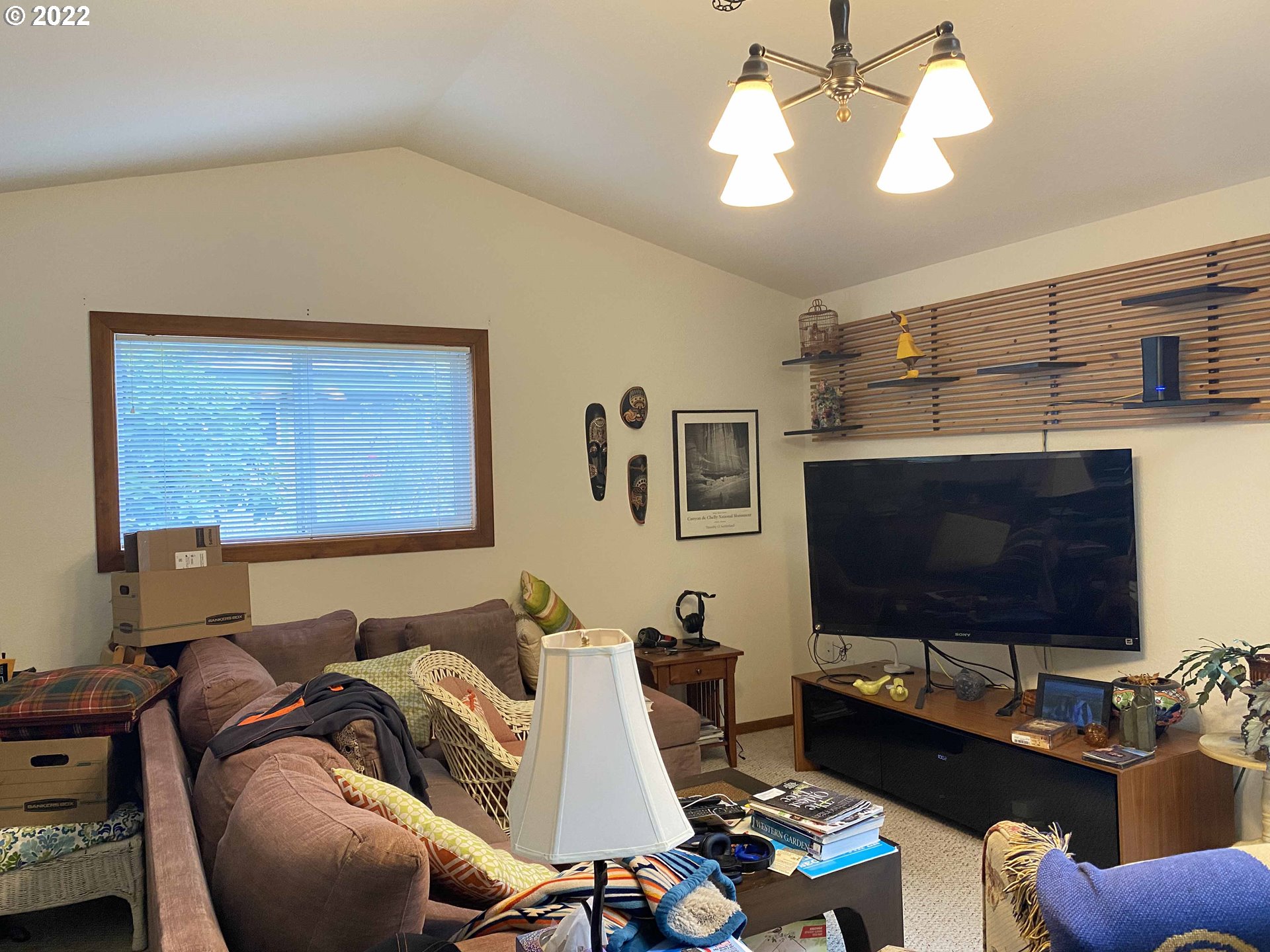 2222 11th Street Florence, OR 97439 - Photo 23 of 32 a living room with furniture and a flat screen tv