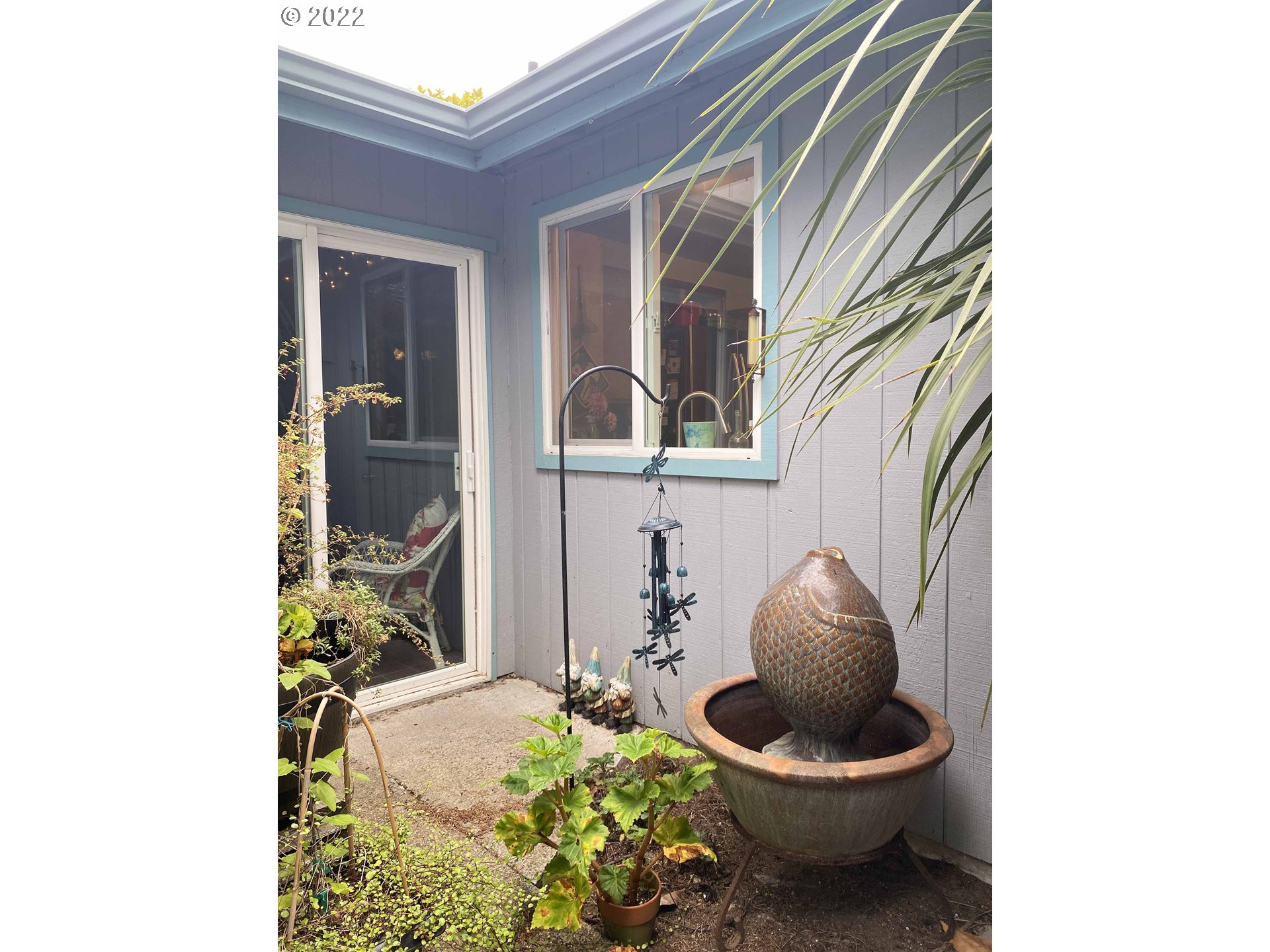 2222 11th Street Florence, OR 97439 - Photo 25 of 32 a bathroom with a toilet and a mirror