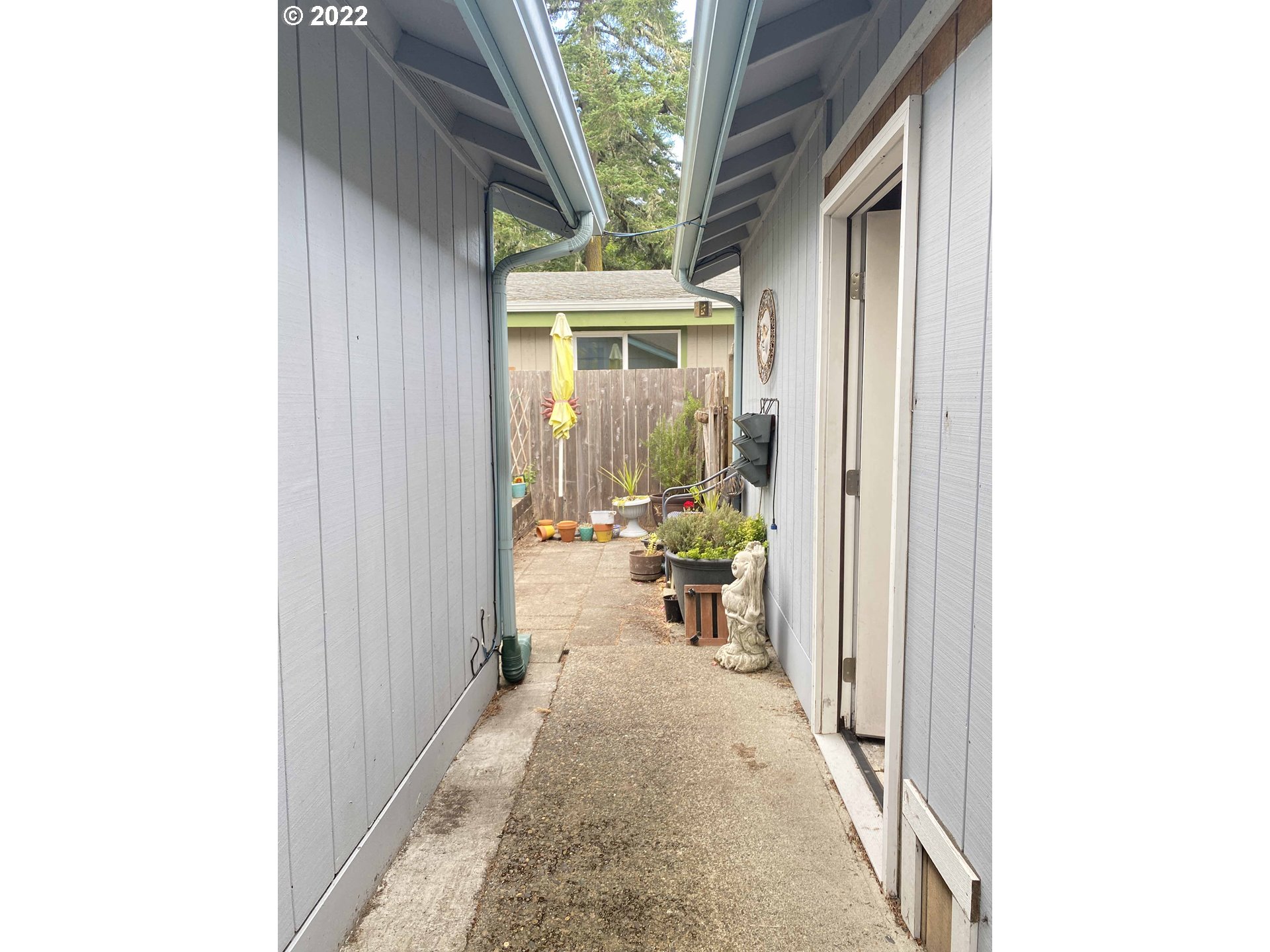 2222 11th Street Florence, OR 97439 - Photo 26 of 32 a view of a hallway with a outdoor space