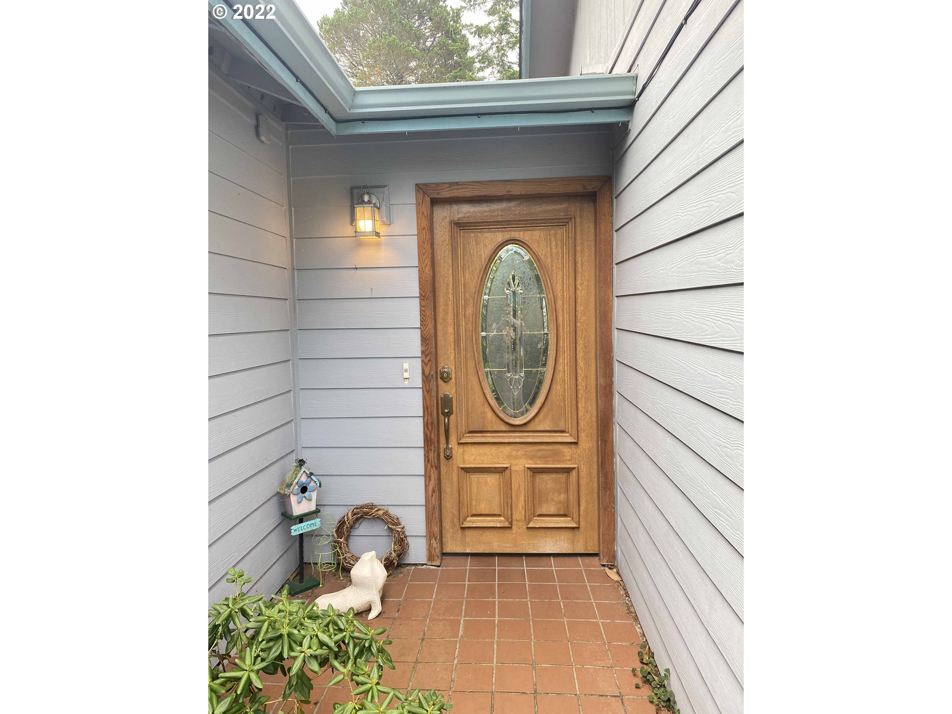 2222 11th Street Florence, OR 97439 - Photo 4 of 32 a close up of a door of a house