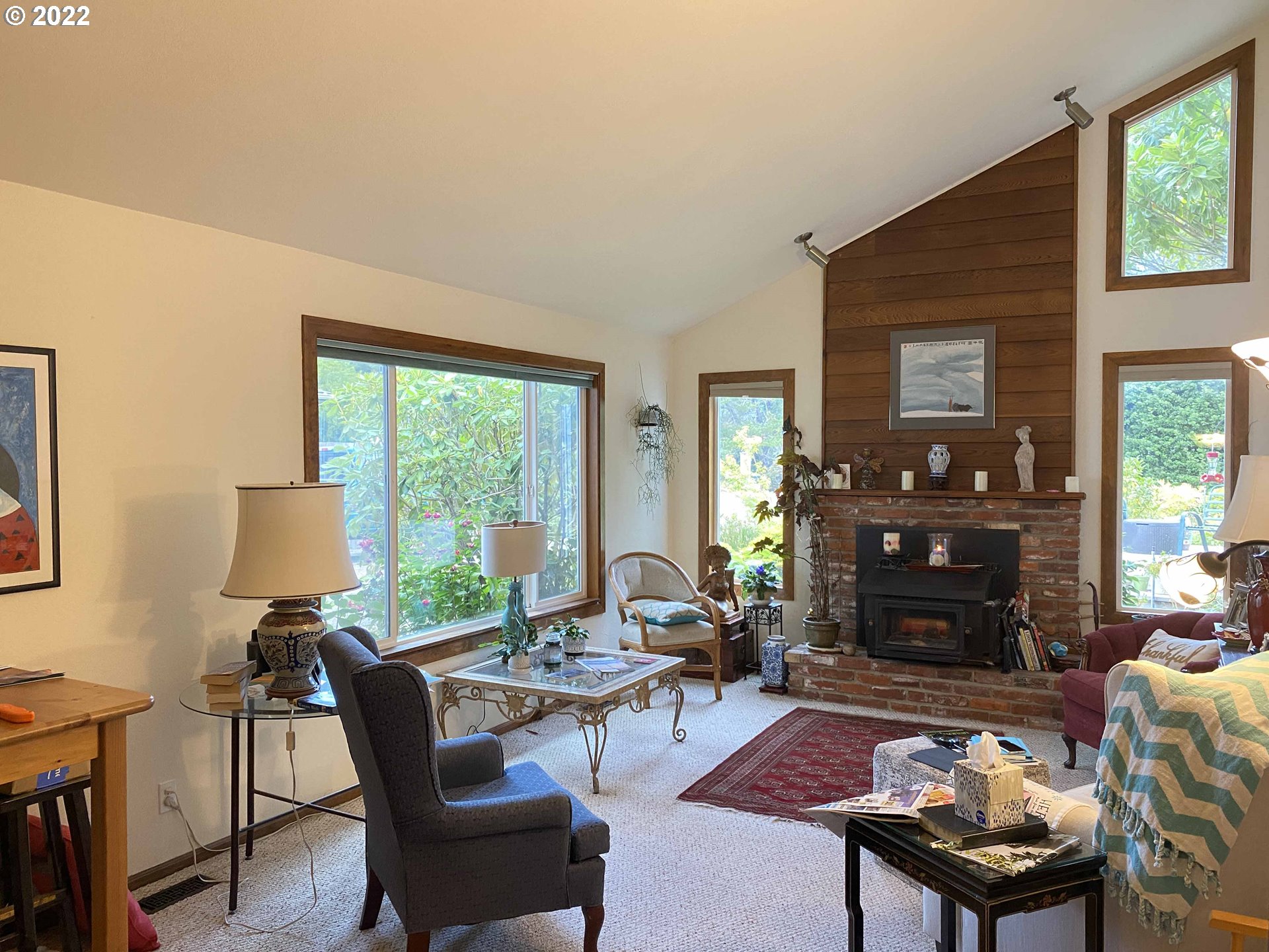 2222 11th Street Florence, OR 97439 - Photo 7 of 32 a living room with furniture a fireplace and a table