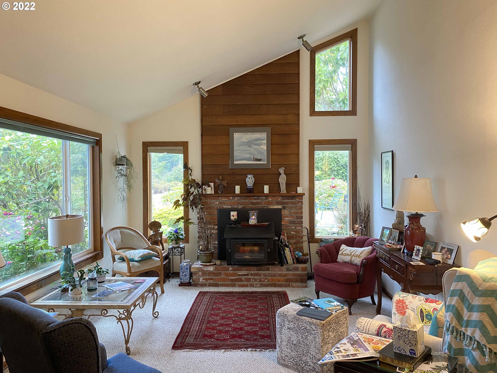 2222 11th Street Florence, OR 97439 - Photo 8 of 32 a living room with furniture fireplace and window