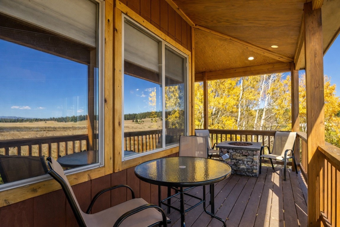 155 Lamb Mountain Road Fairplay, CO 80440 - Photo 14 of 48 Deck featuring a fire pit and outdoor dining space
