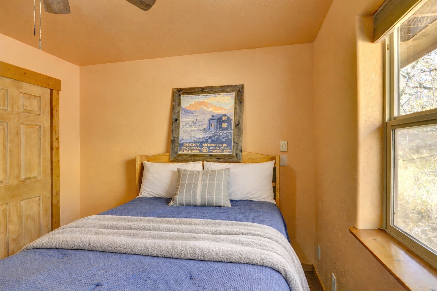 155 Lamb Mountain Road Fairplay, CO 80440 - Photo 18 of 48 a bedroom with a bed and a window