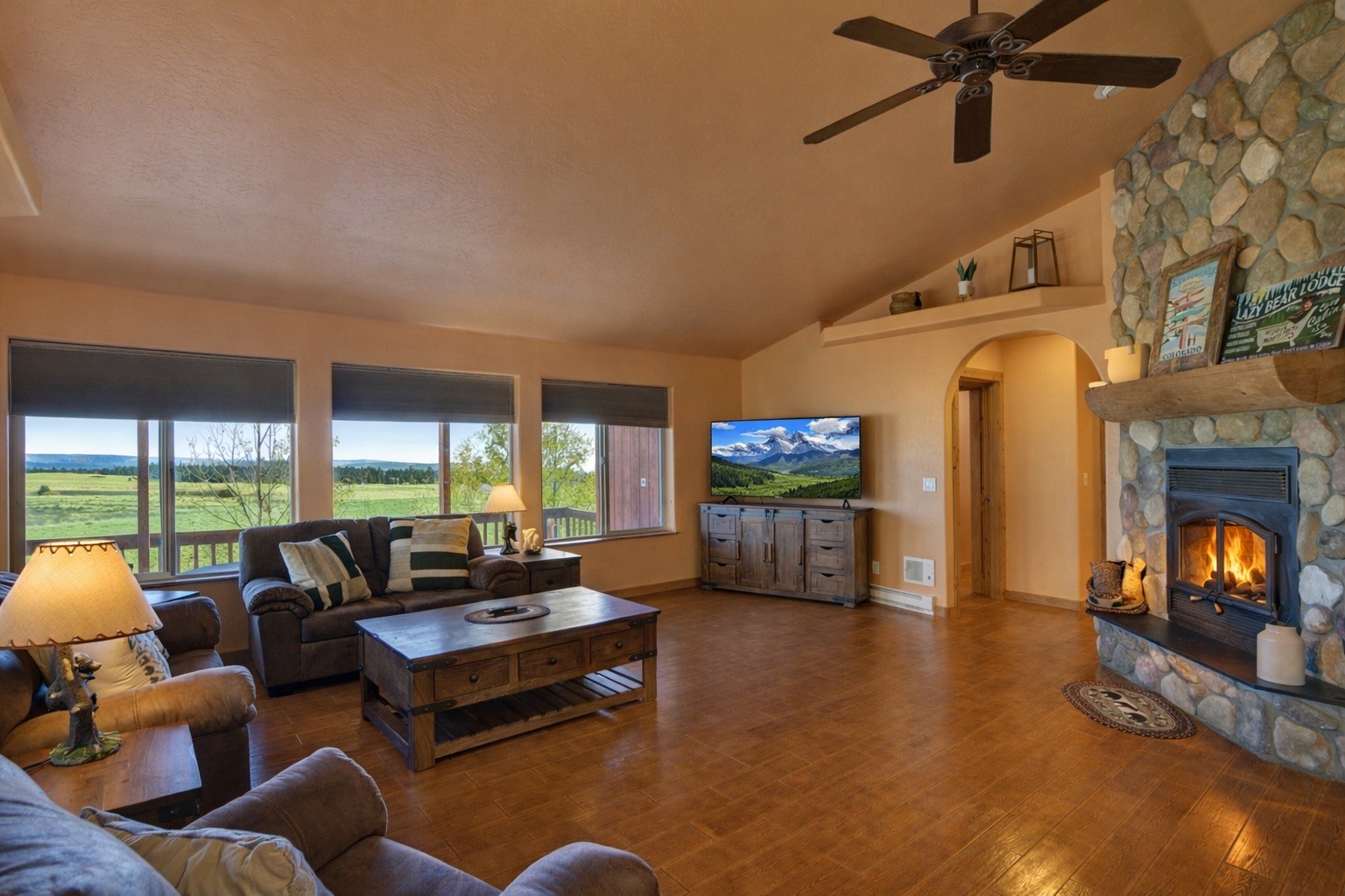 155 Lamb Mountain Road Fairplay, CO 80440 - Photo 4 of 48 a living room with furniture and a fireplace