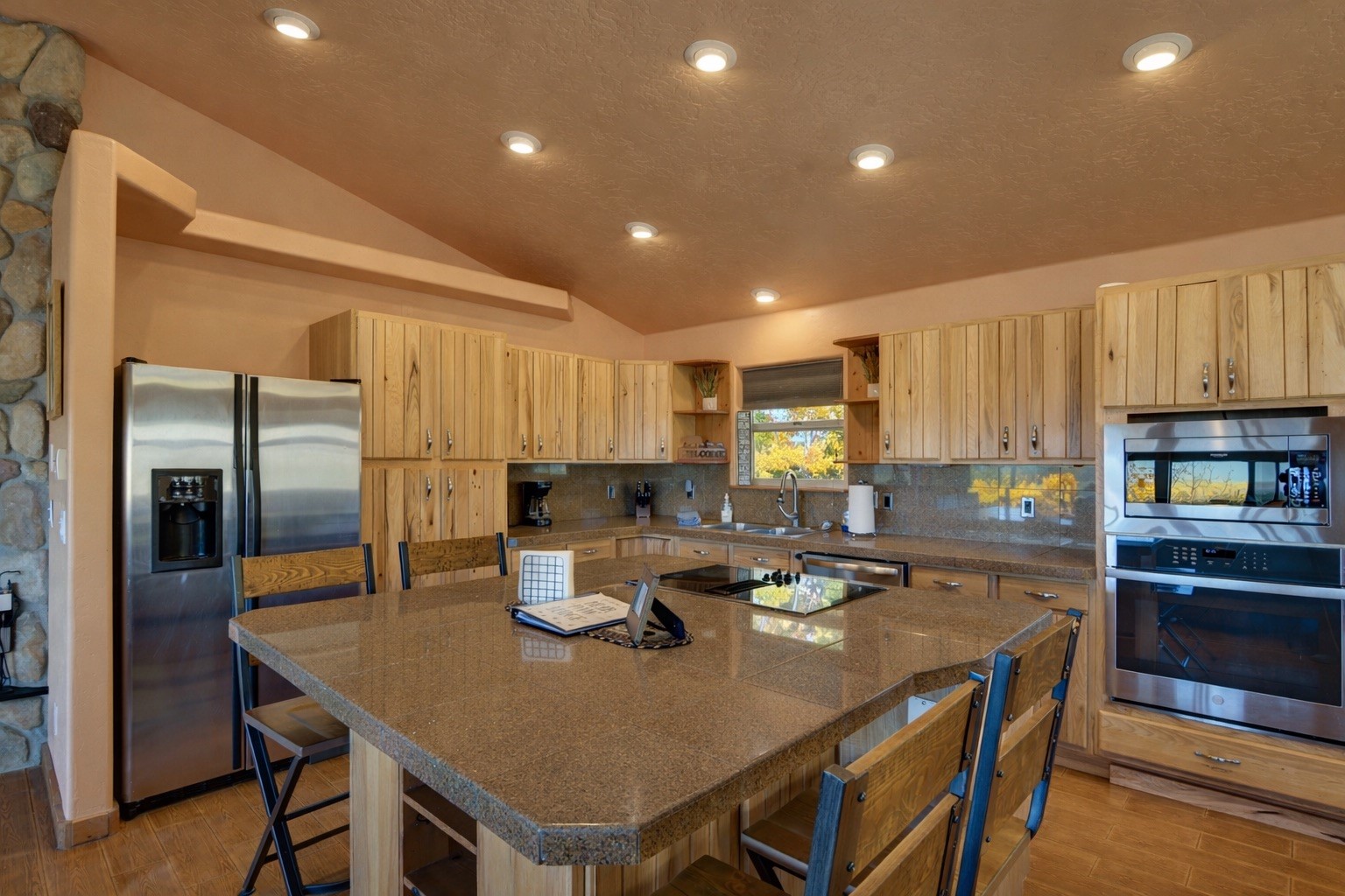 155 Lamb Mountain Road Fairplay, CO 80440 - Photo 8 of 48 a kitchen with a dining table chairs and refrigerator