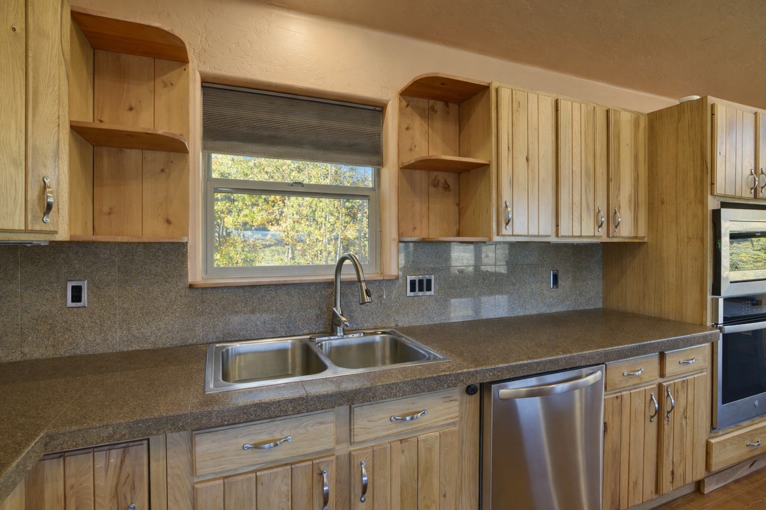 155 Lamb Mountain Road Fairplay, CO 80440 - Photo 9 of 48 a kitchen with stainless steel appliances a sink a stove and a window