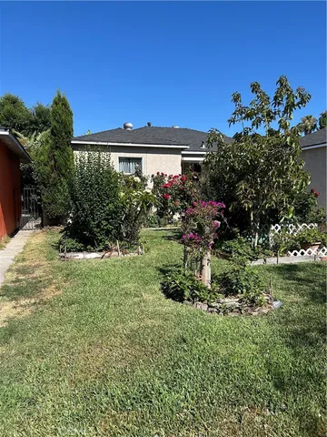 a view of a house with a garden