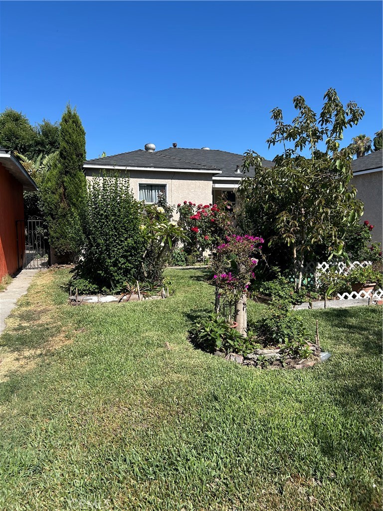 a view of a house with a garden
