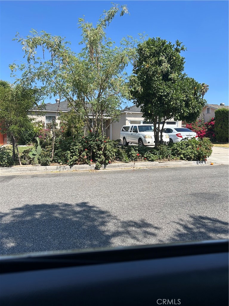 6720 Sherman Way Bell, CA 90201 - Photo 2 of 15 front view of a house with a street