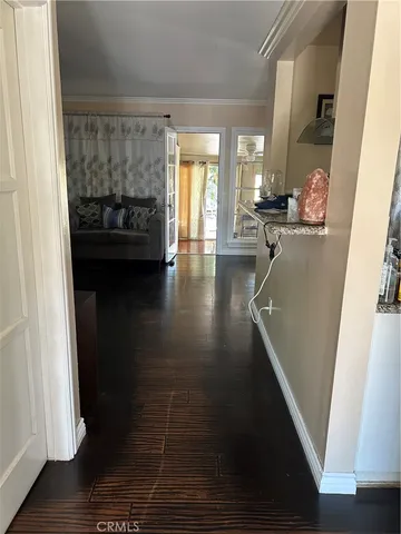 a view of livingroom and dining room with wooden floor