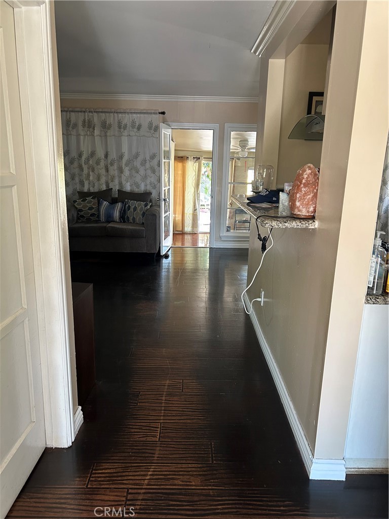 6720 Sherman Way Bell, CA 90201 - Photo 3 of 15 a view of livingroom and dining room with wooden floor