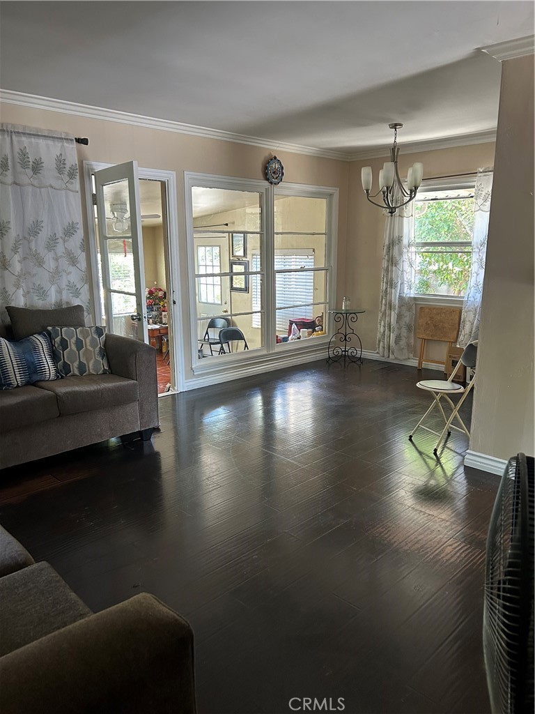 6720 Sherman Way Bell, CA 90201 - Photo 4 of 15 a living room with furniture and a large window