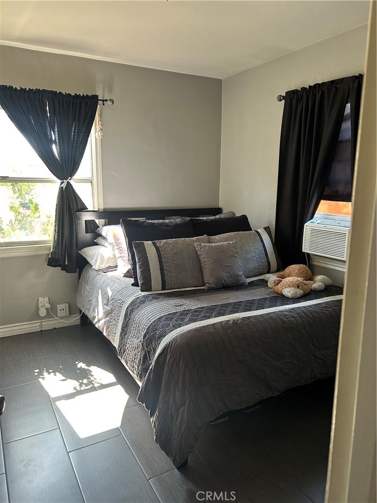 6720 Sherman Way Bell, CA 90201 - Photo 10 of 15 a bed sitting in a bedroom next to a window