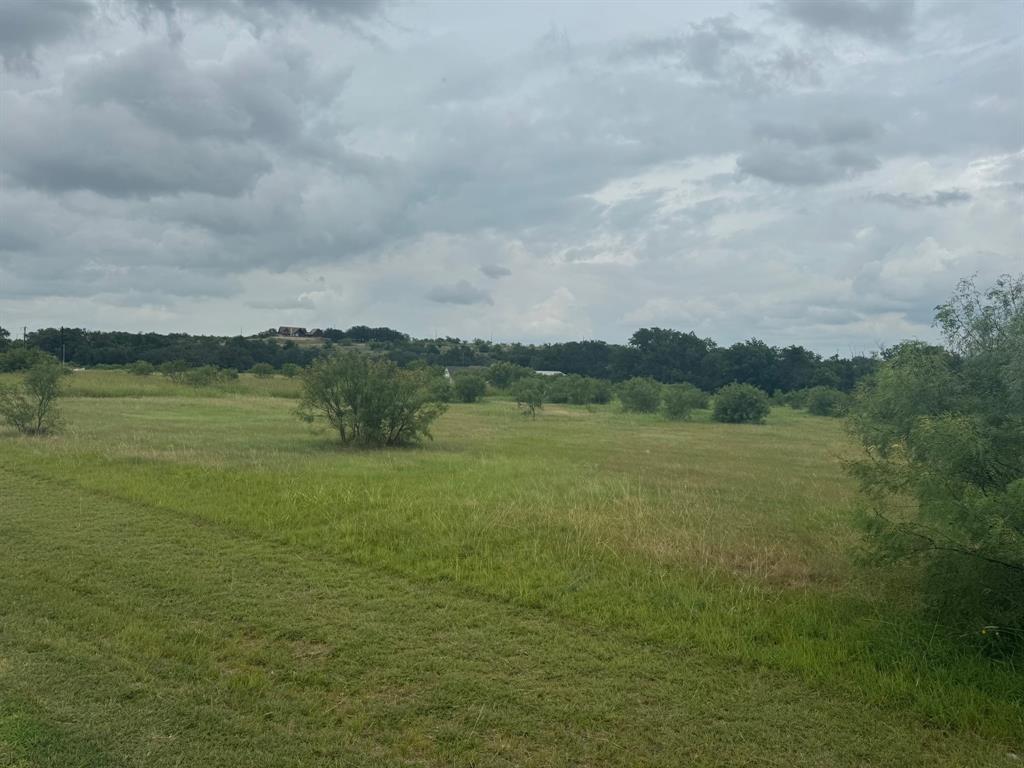 Tbd Tbd Mercers Preserve Road Comanche, TX 76442 - Photo 4 of 4 a view of a lake with houses in the back
