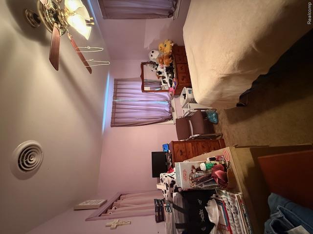 7813 Rookway Road Birch Run, MI 48415 - Photo 30 of 62 Bedroom featuring dark carpet and ceiling fan