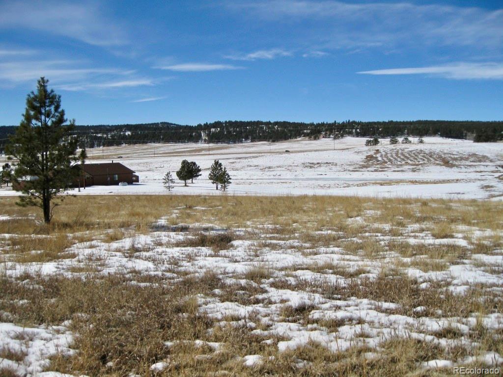 486 High Pasture Road Florissant, CO 80816 - Photo 3 of 15 a view of a ocean with sunset