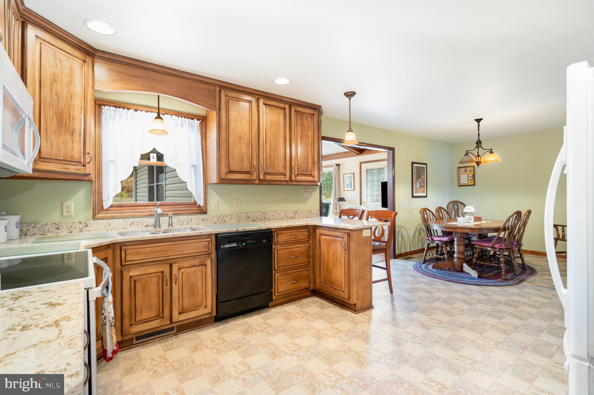 29 Robin Circle Halifax, PA 17032 - Photo 14 of 35 a kitchen with sink cabinets and dining table