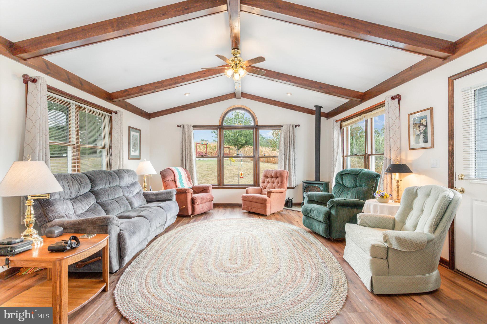 29 Robin Circle Halifax, PA 17032 - Photo 15 of 35 a living room with furniture a large window and a chandelier