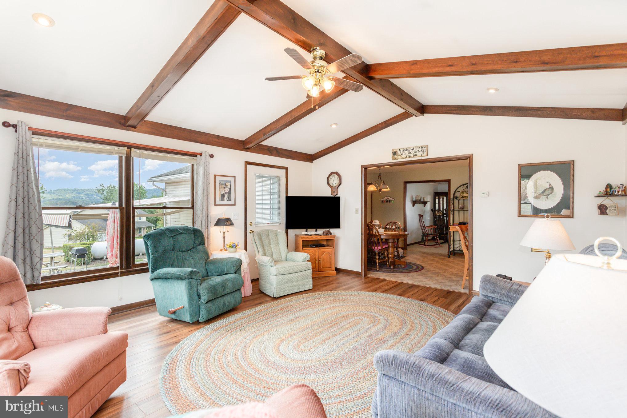 29 Robin Circle Halifax, PA 17032 - Photo 16 of 35 a living room with furniture large window and flat screen tv