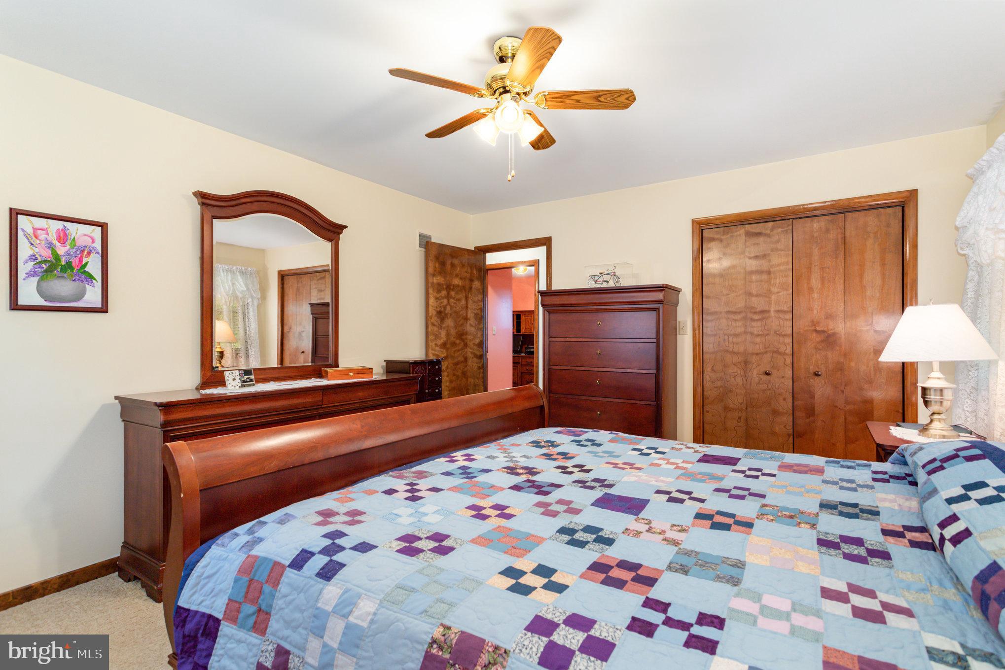 29 Robin Circle Halifax, PA 17032 - Photo 18 of 35 a bedroom with a bed and a chandelier