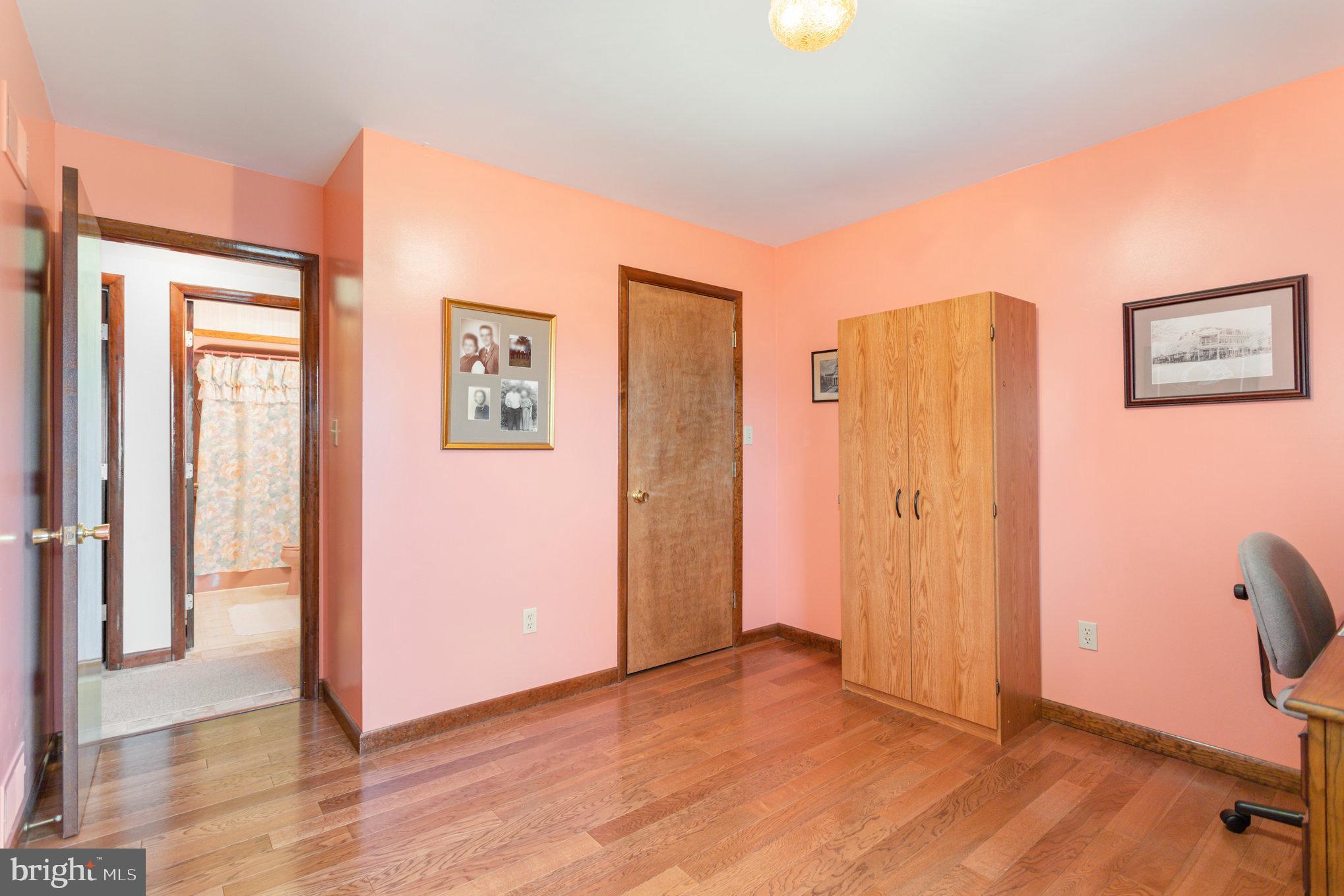 29 Robin Circle Halifax, PA 17032 - Photo 23 of 35 a view of a bedroom with wooden floor and bathroom