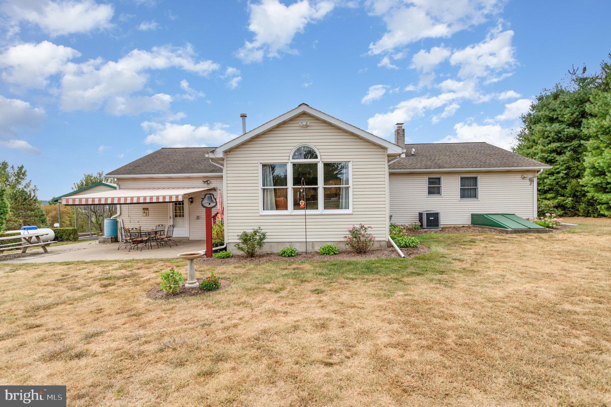 29 Robin Circle Halifax, PA 17032 - Photo 25 of 35 a front view of a house with a yard and garage
