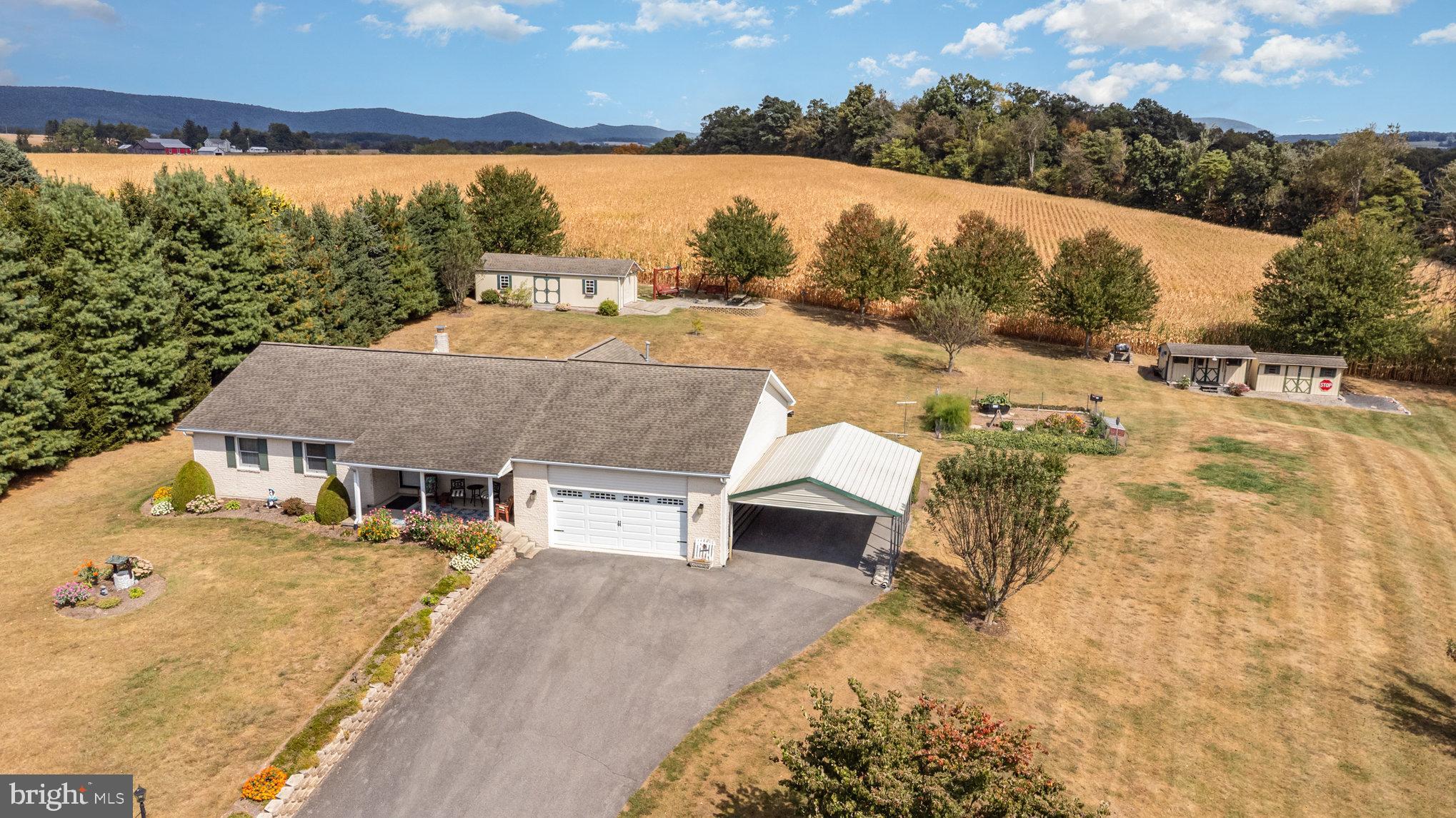 29 Robin Circle Halifax, PA 17032 - Photo 6 of 35 a view of a house with a yard covered in snow