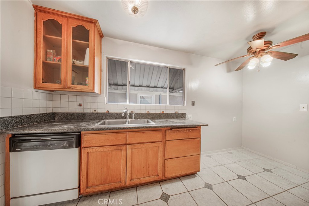 10531 Mulhall Street El Monte, CA 91731 - Photo 5 of 13 a kitchen with stainless steel appliances granite countertop a sink and cabinets
