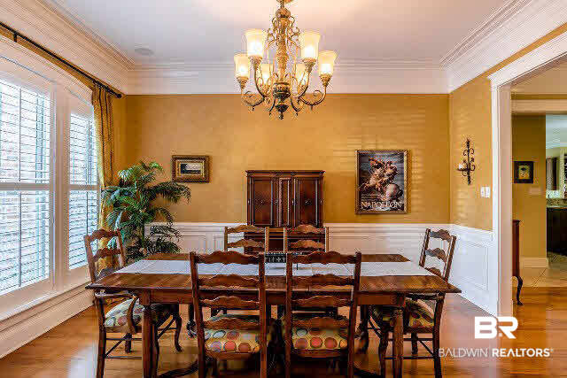 33509 Alder Circle Daphne, AL 36527 - Photo 3 of 28 Formal Dining Room with Wainscotting and Plantation Shutters