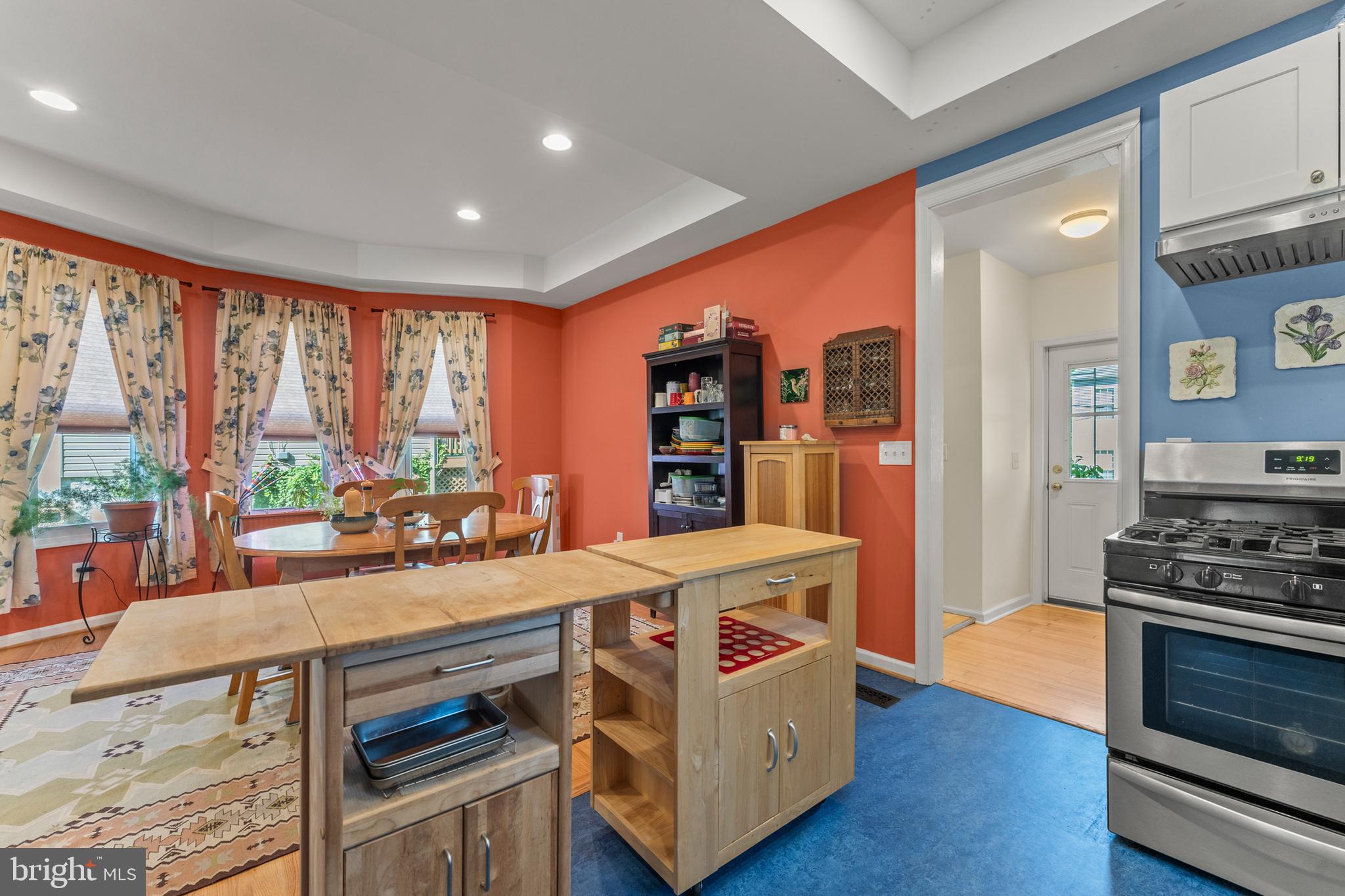 5012 Catalpha Road Baltimore, MD 21214 - Photo 13 of 44 a room with furniture a large window and wooden floor