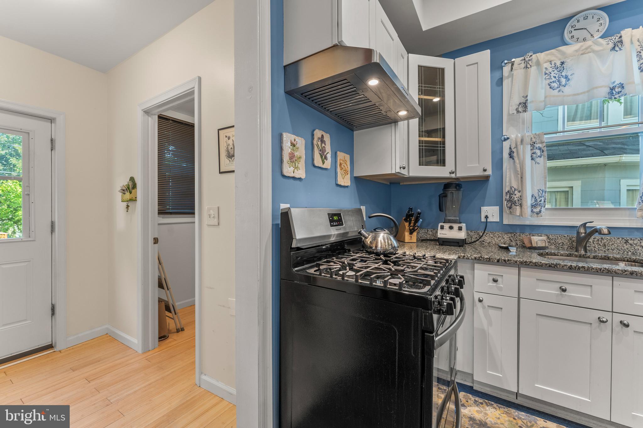 5012 Catalpha Road Baltimore, MD 21214 - Photo 15 of 44 a kitchen with stainless steel appliances granite countertop a stove refrigerator and cabinets