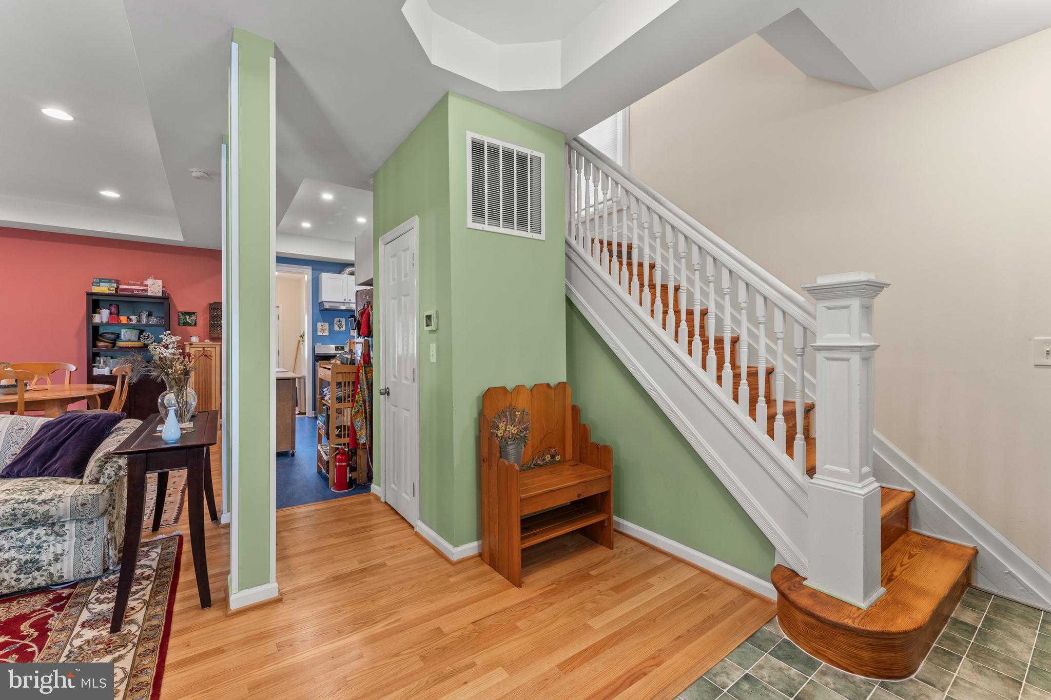 5012 Catalpha Road Baltimore, MD 21214 - Photo 2 of 44 a view of an entryway with wooden floor and windows