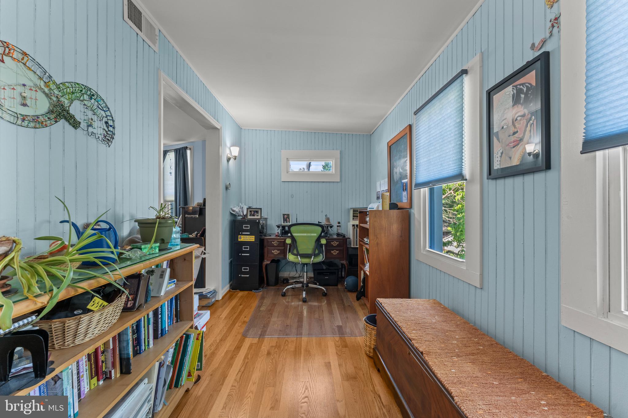 5012 Catalpha Road Baltimore, MD 21214 - Photo 23 of 44 a bedroom with furniture and a book shelf
