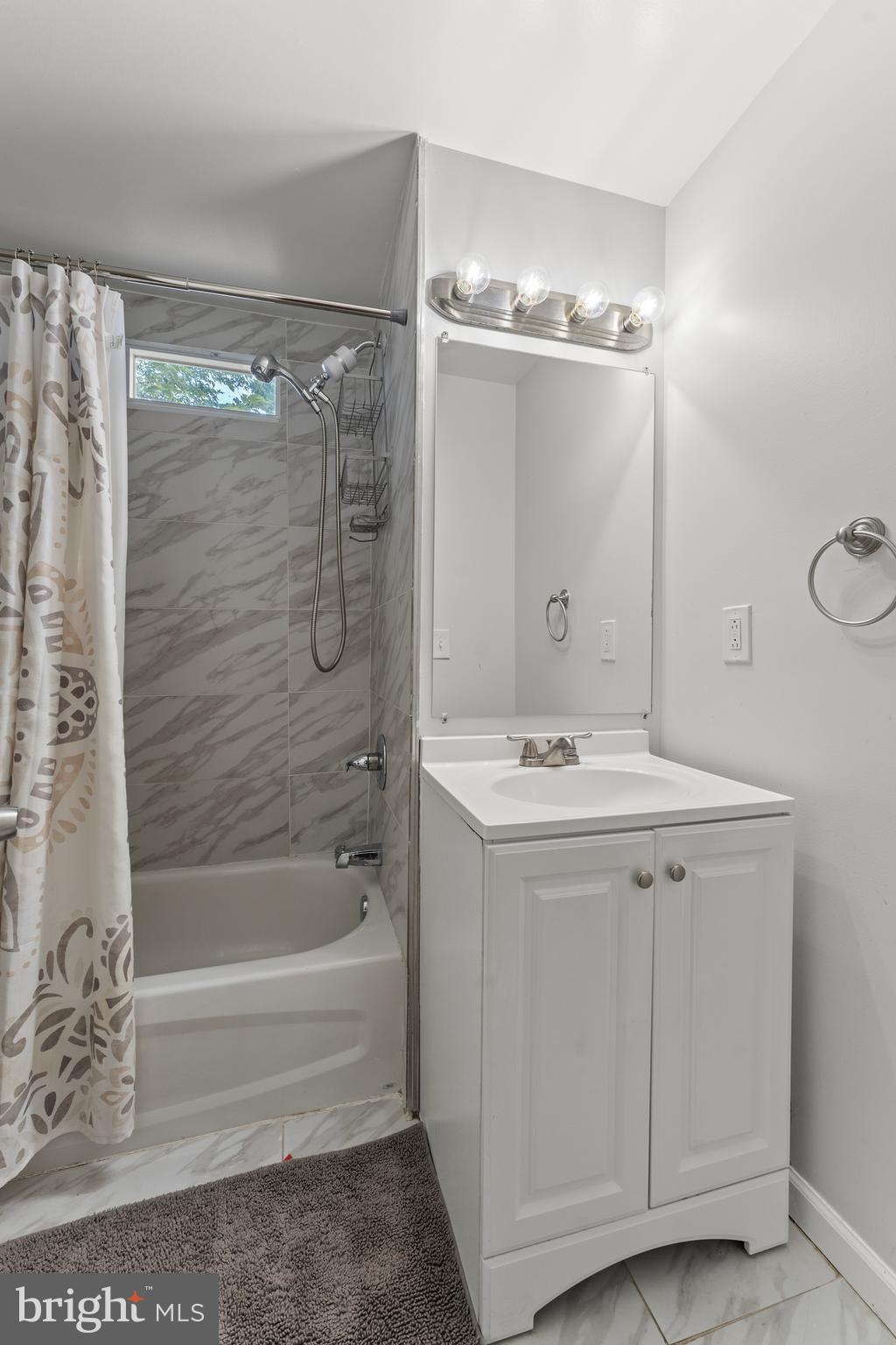 5012 Catalpha Road Baltimore, MD 21214 - Photo 24 of 44 a bathroom with a bathtub and a shower
