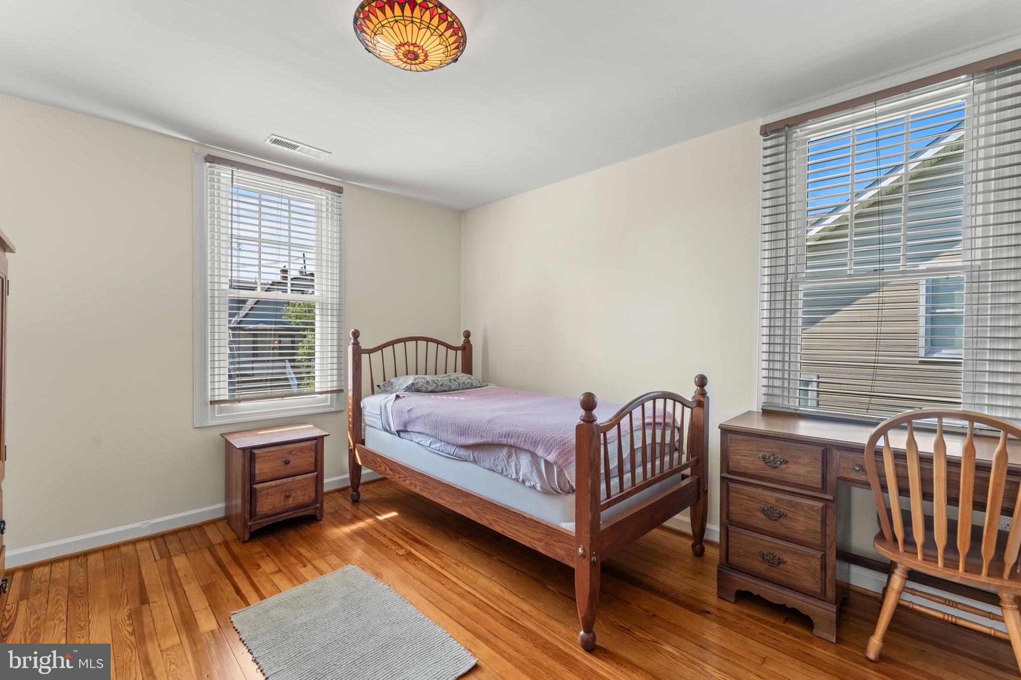 5012 Catalpha Road Baltimore, MD 21214 - Photo 30 of 44 a bedroom with a bed and a window