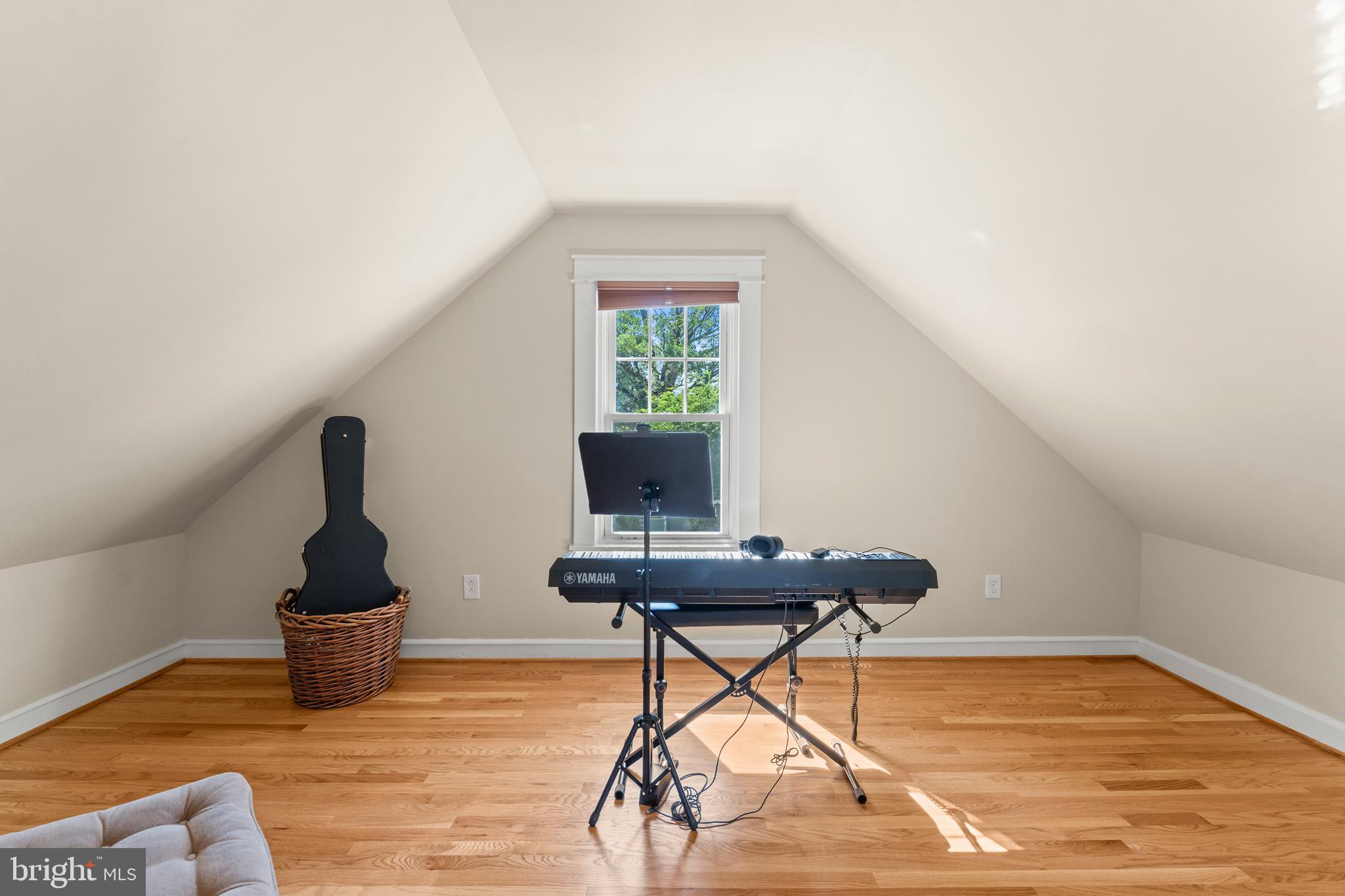 5012 Catalpha Road Baltimore, MD 21214 - Photo 32 of 44 a table and chair in a room next to a window