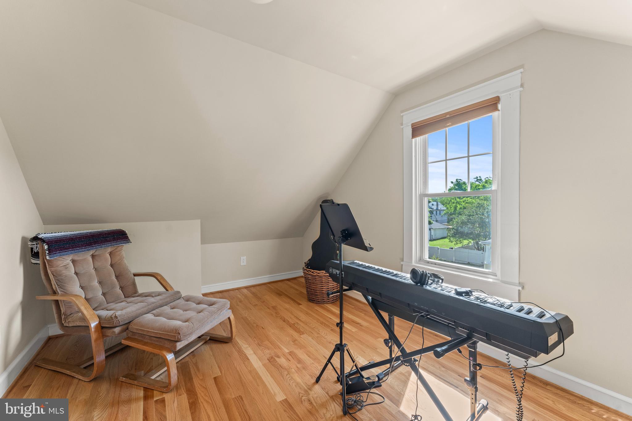 5012 Catalpha Road Baltimore, MD 21214 - Photo 33 of 44 a view of a workspace with furniture and a window