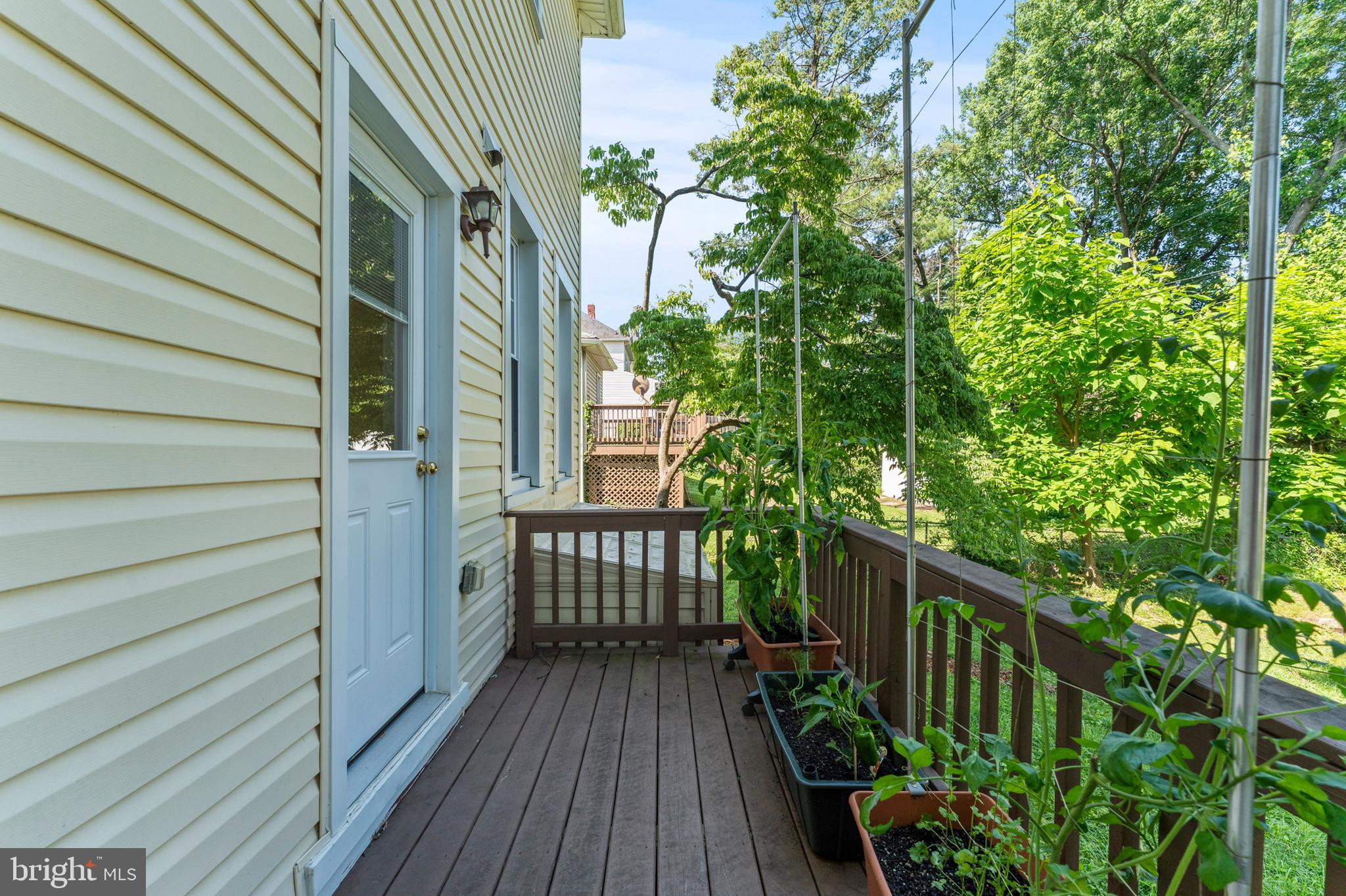 5012 Catalpha Road Baltimore, MD 21214 - Photo 34 of 44 a view of balcony with wooden floor