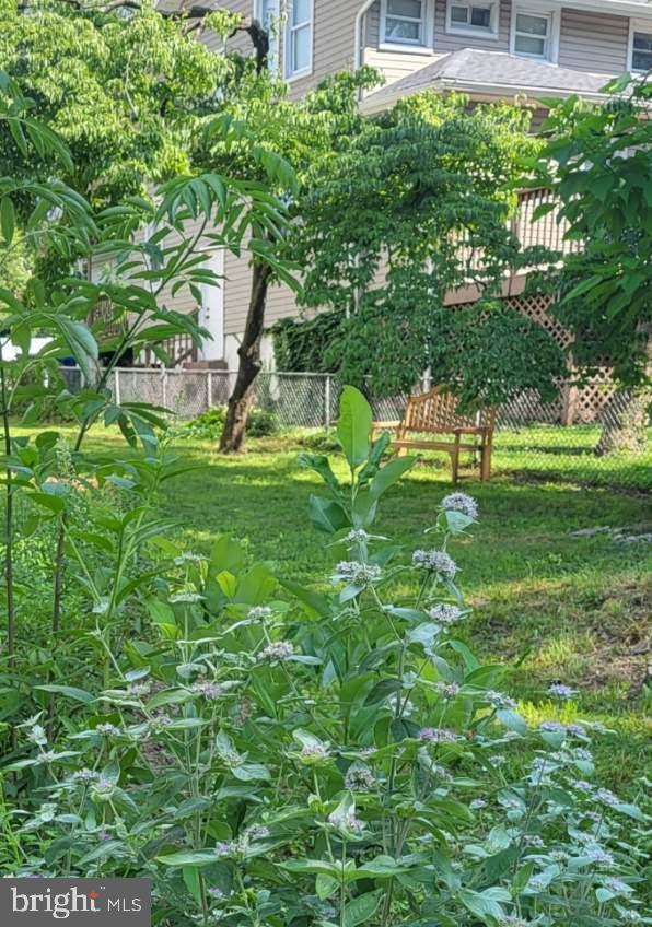 5012 Catalpha Road Baltimore, MD 21214 - Photo 41 of 44 a backyard of a house with lots of green space and fountain
