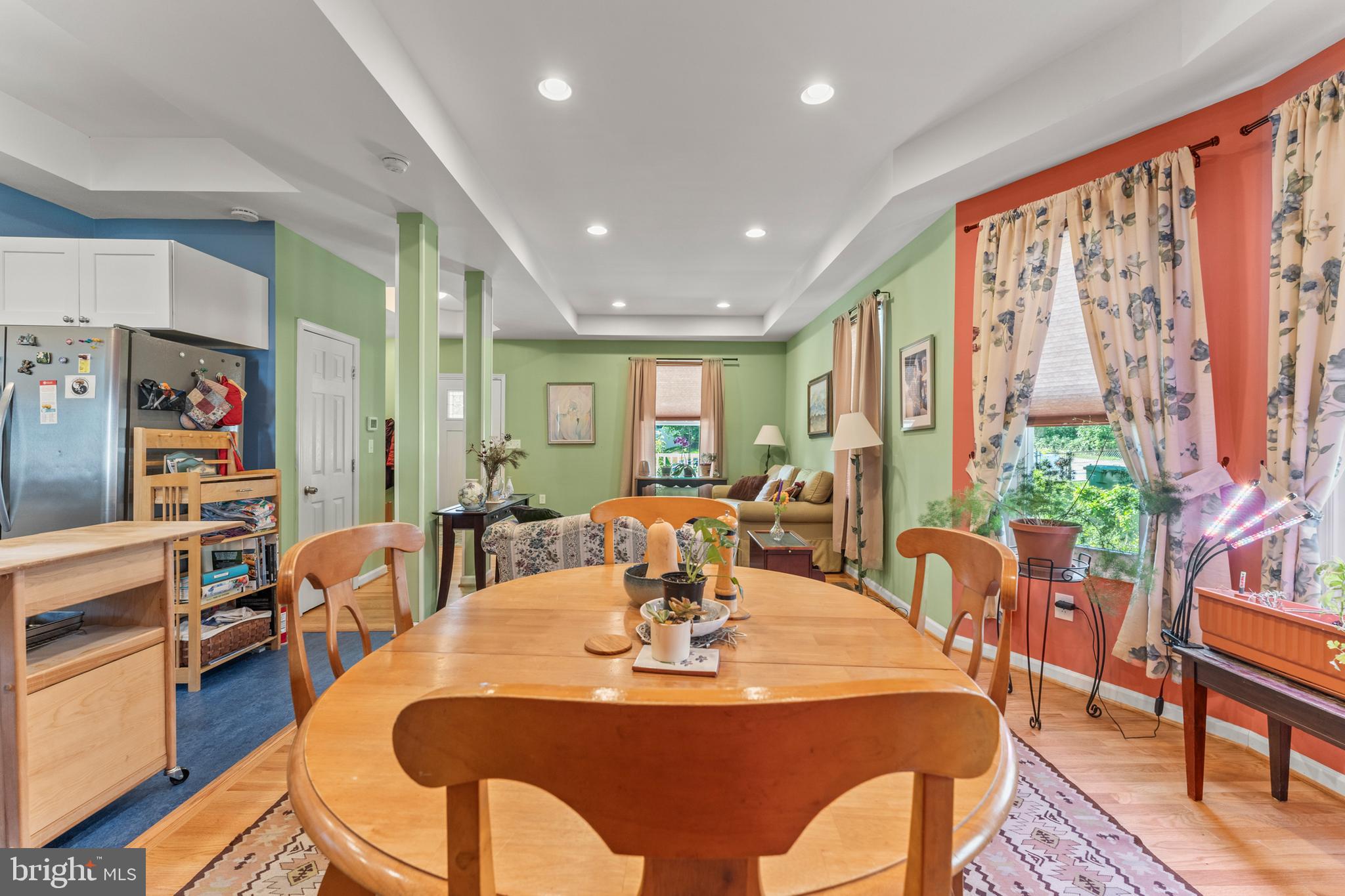 5012 Catalpha Road Baltimore, MD 21214 - Photo 7 of 44 a view of a dining room with furniture window and wooden floor