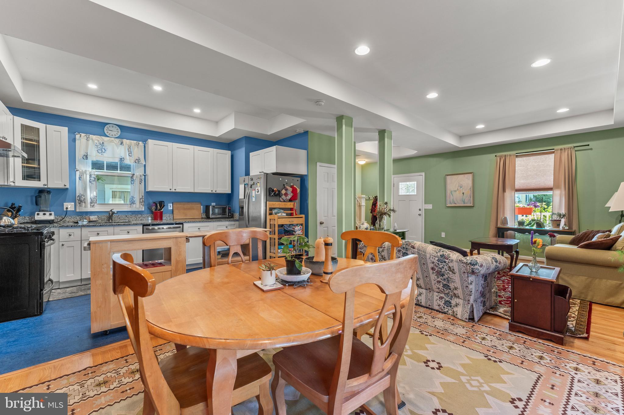 5012 Catalpha Road Baltimore, MD 21214 - Photo 8 of 44 a view of a dining room with furniture window and wooden floor