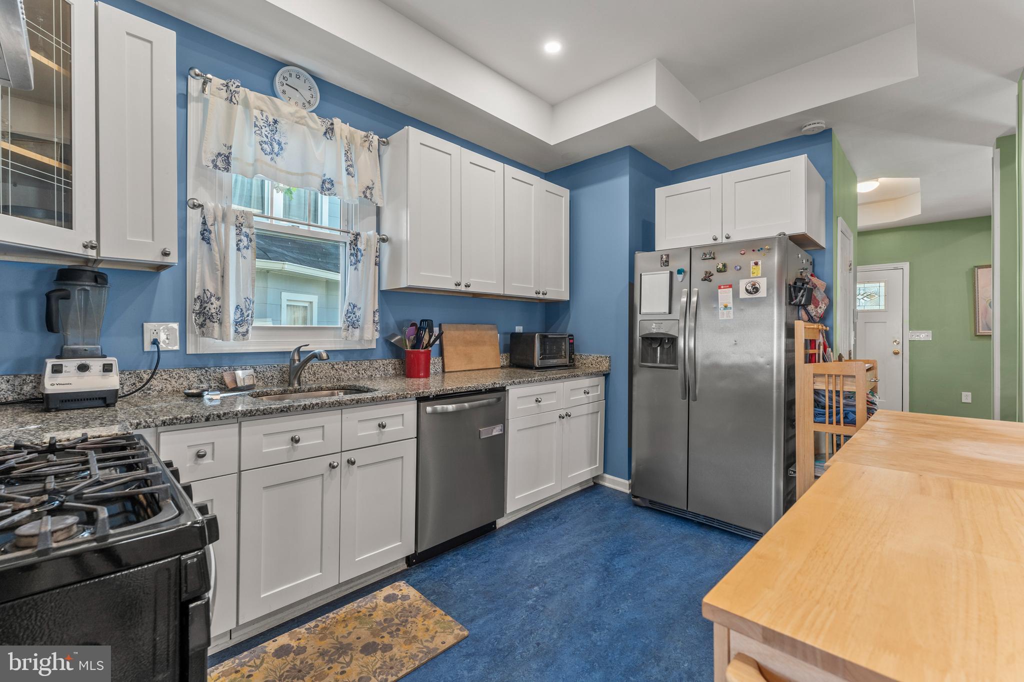 5012 Catalpha Road Baltimore, MD 21214 - Photo 10 of 44 a kitchen with stainless steel appliances granite countertop a refrigerator sink and stove