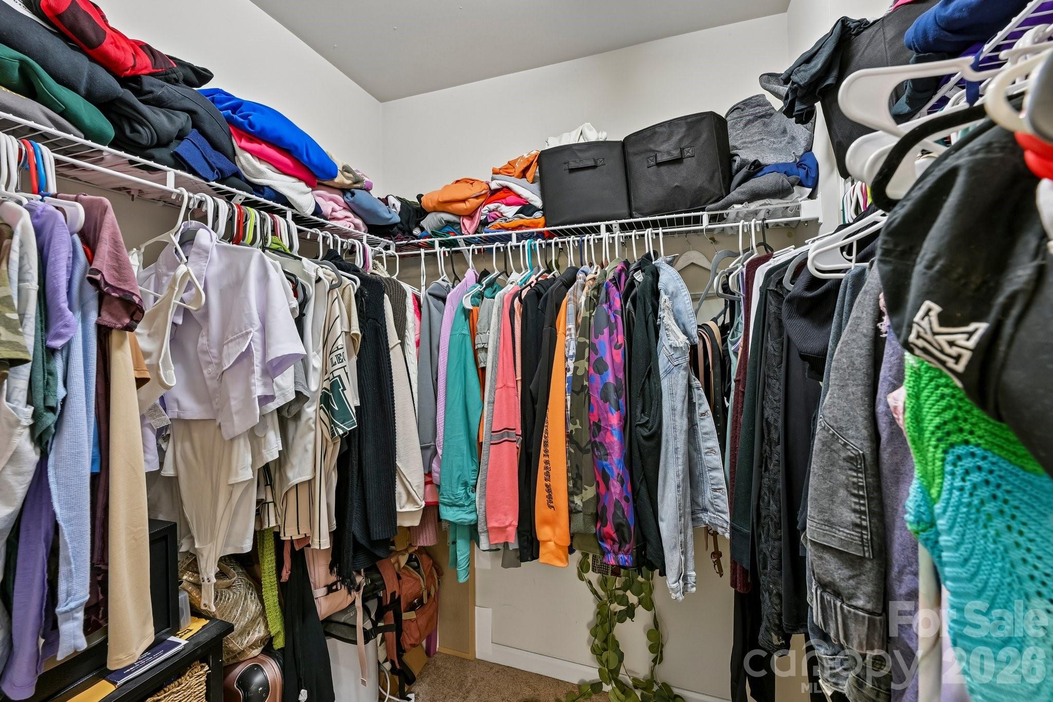 2206 Turtle Point Road Charlotte, NC 28262 - Photo 18 of 28 a view of walk in closet with clothes