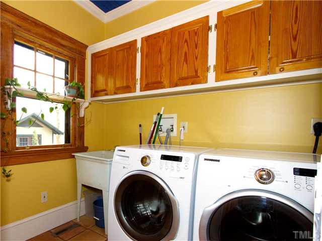 518 Elm Street Raleigh, NC 27604 - Photo 19 of 23 This interior laundry is convenienlty located in the home, it has TONS of storage, a utility sink, AND the washer dryer are included. Laundry Room