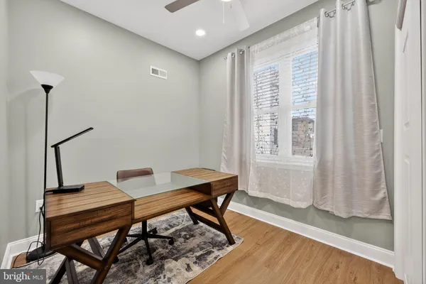 a view of a workspace with furniture