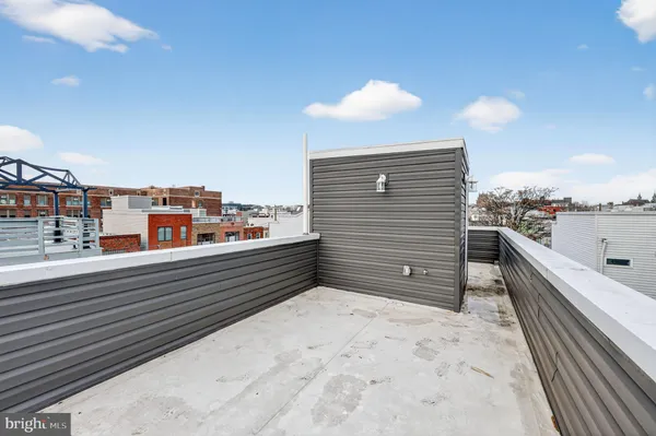a view of a patio with couches and potted plants